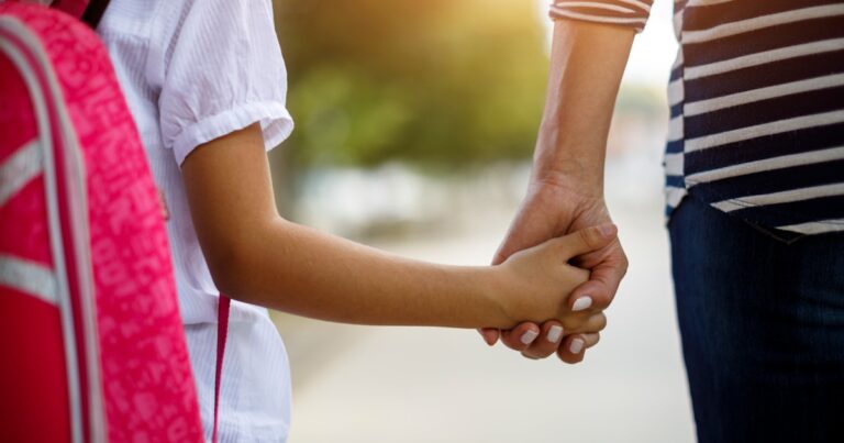 mother daughter holding hands