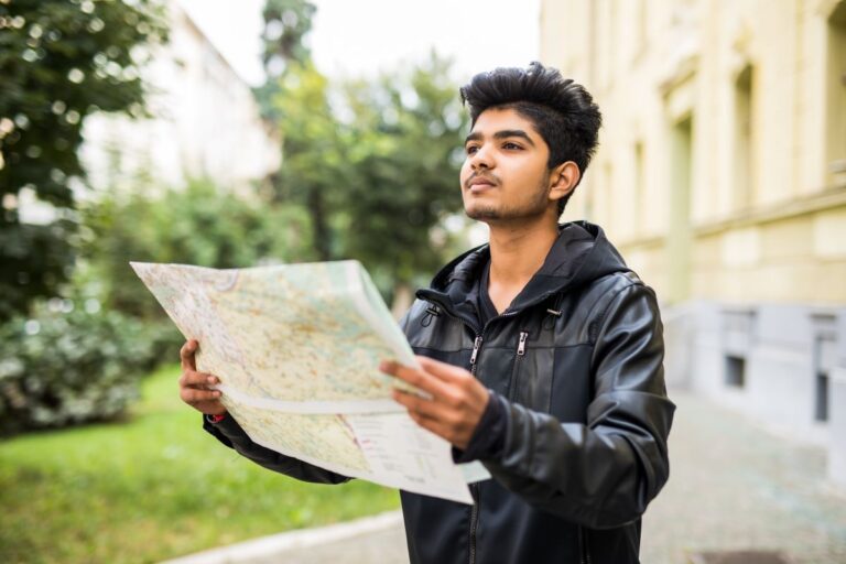 lost indian tourist looking city map trip